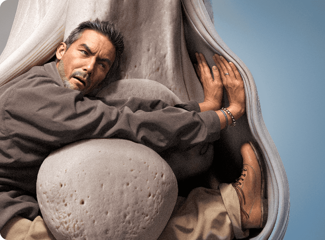 A man with his body uncomfortably wrapped around a bone joint